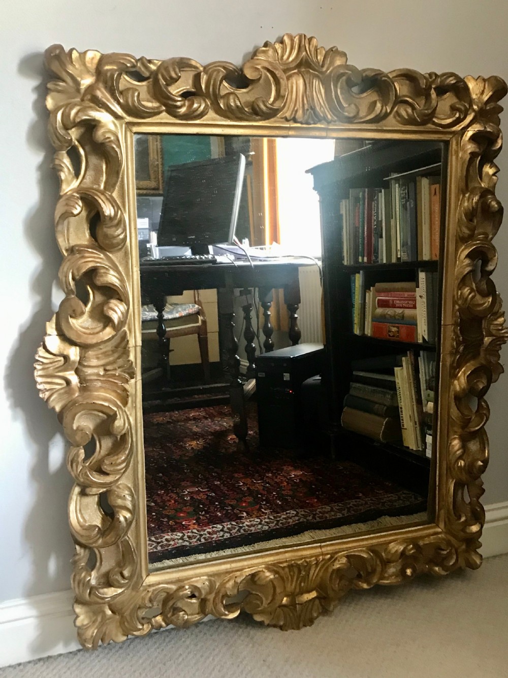 Early 19th century Florentine carved and giltwood mirror.