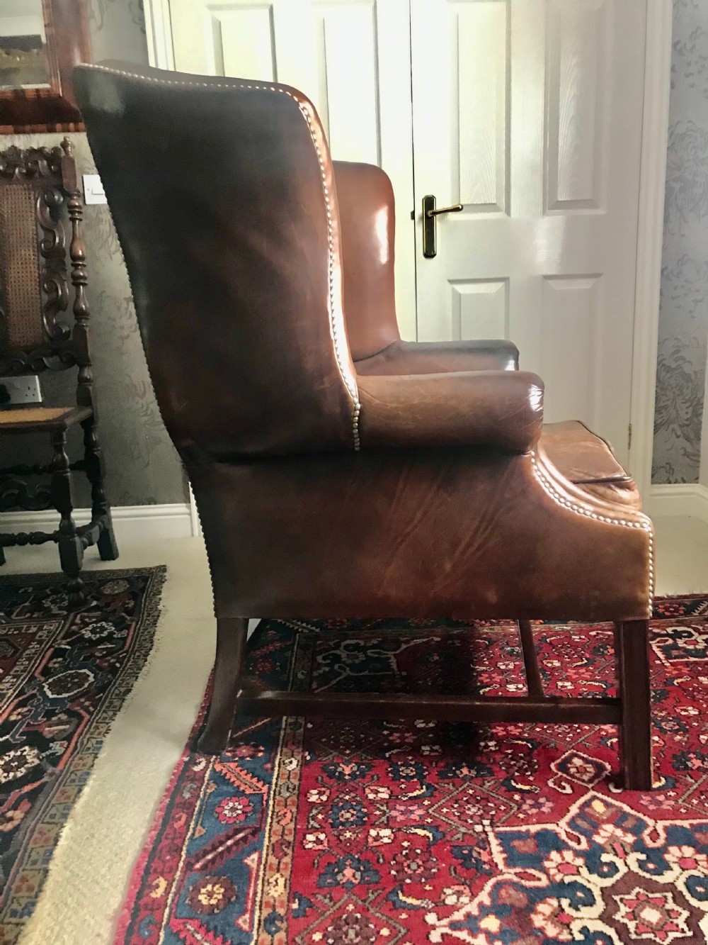 18th century style leather and mahogany wing chair, early 20th century. View VI