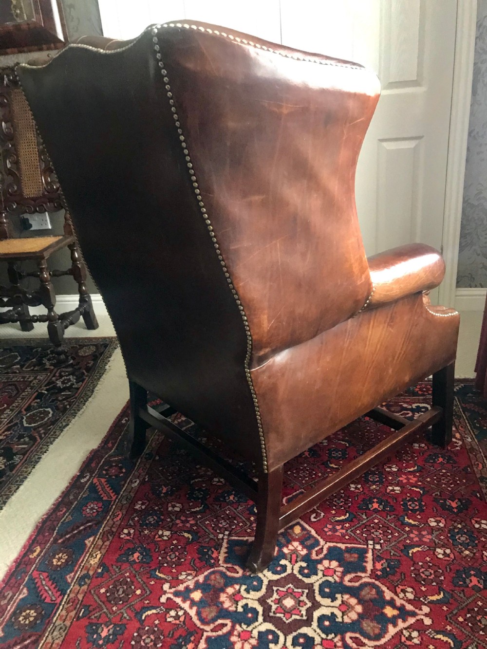 18th century style leather and mahogany wing chair, early 20th century. View VII