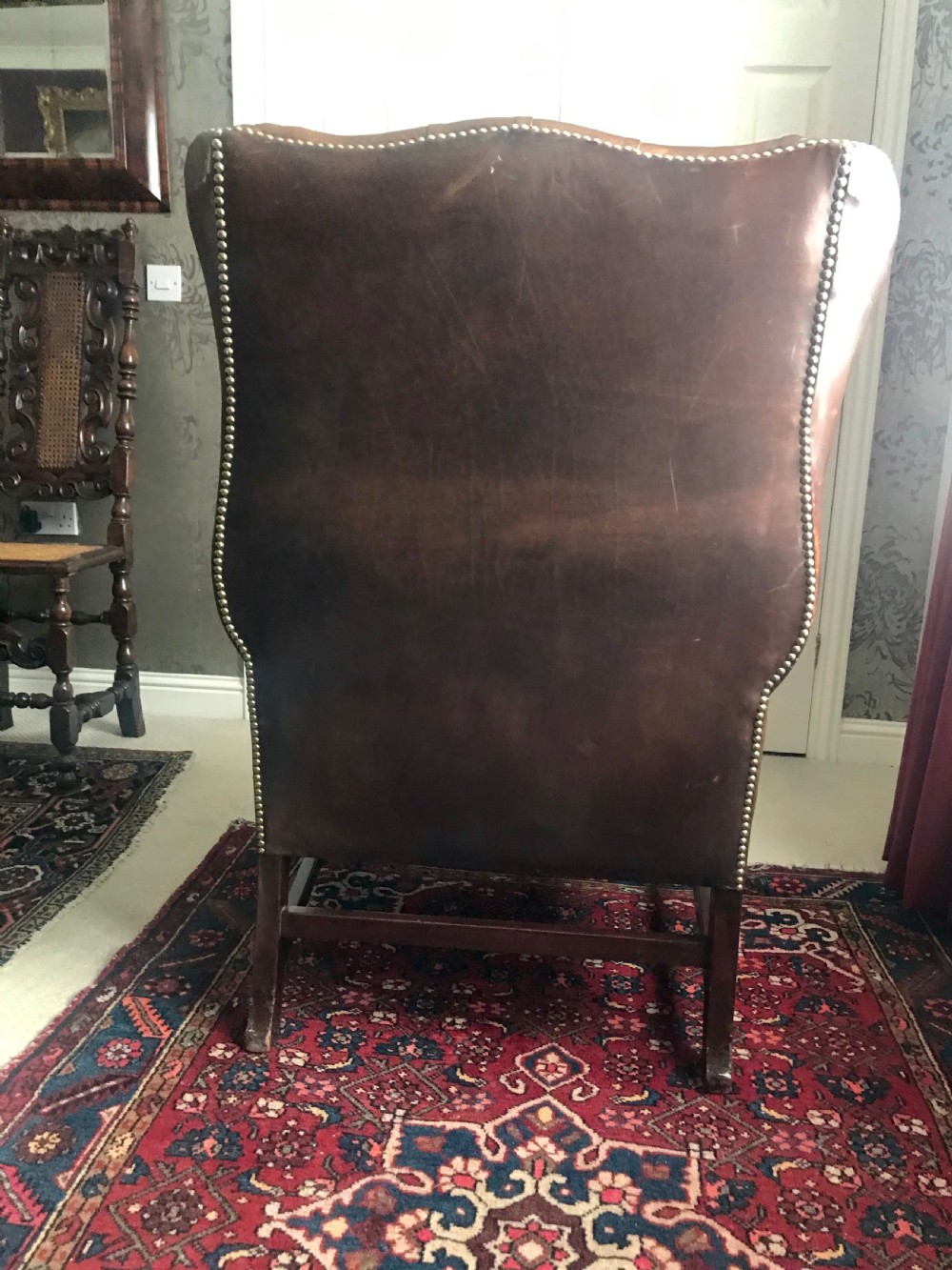 18th century style leather and mahogany wing chair, early 20th century. View VIII