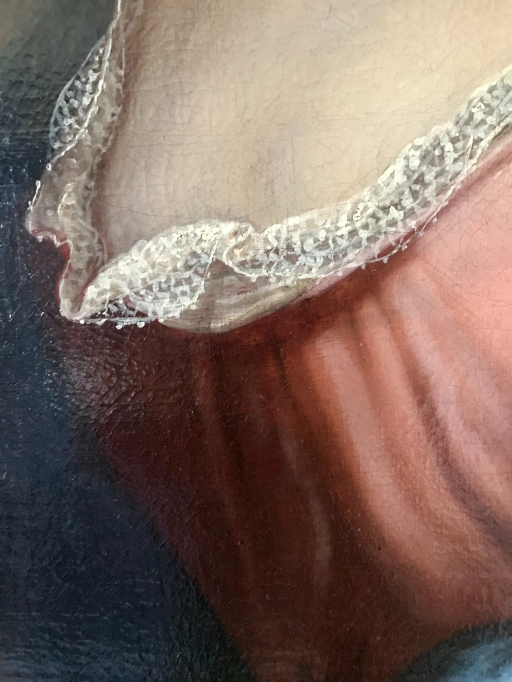 An 18th-century oil painting depicting a woman in a pink gown with lace trimming, set in a gilded wooden frame. View V