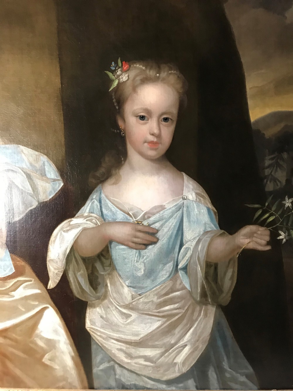 An early 18th-century oil painting depicting two young sisters in silk dresses set against a dark landscape within a gold leaf frame. View III