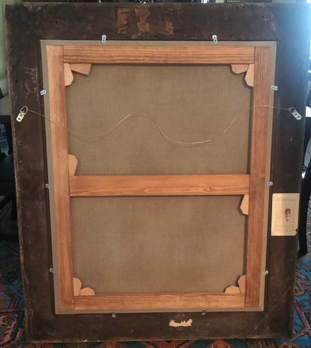 A seventeenth-century oil painting depicting a young gentleman in brown drapery and lace cravat set in a deeply carved giltwood frame. View VI