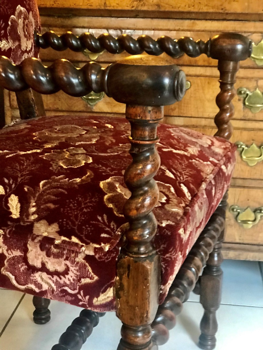 A 17th-century Carolean open armchair made from laburnum wood with spiral barley twist turnings and crimson patterned velvet upholstery. View IV