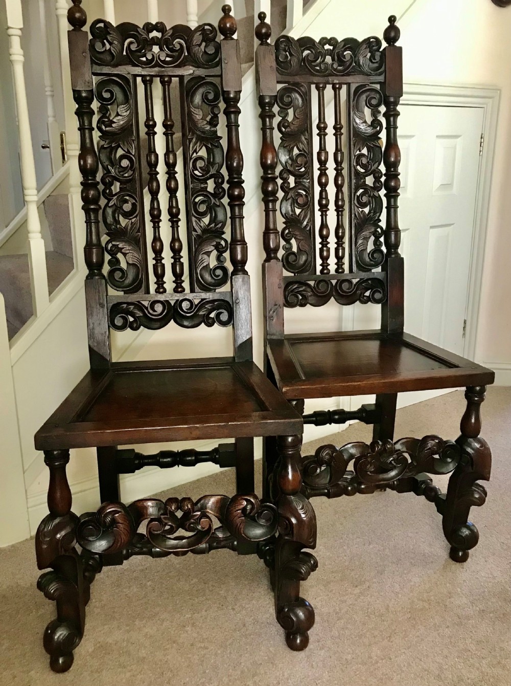 A Fine Pair of Carved Oak Highback chairs c.1690.