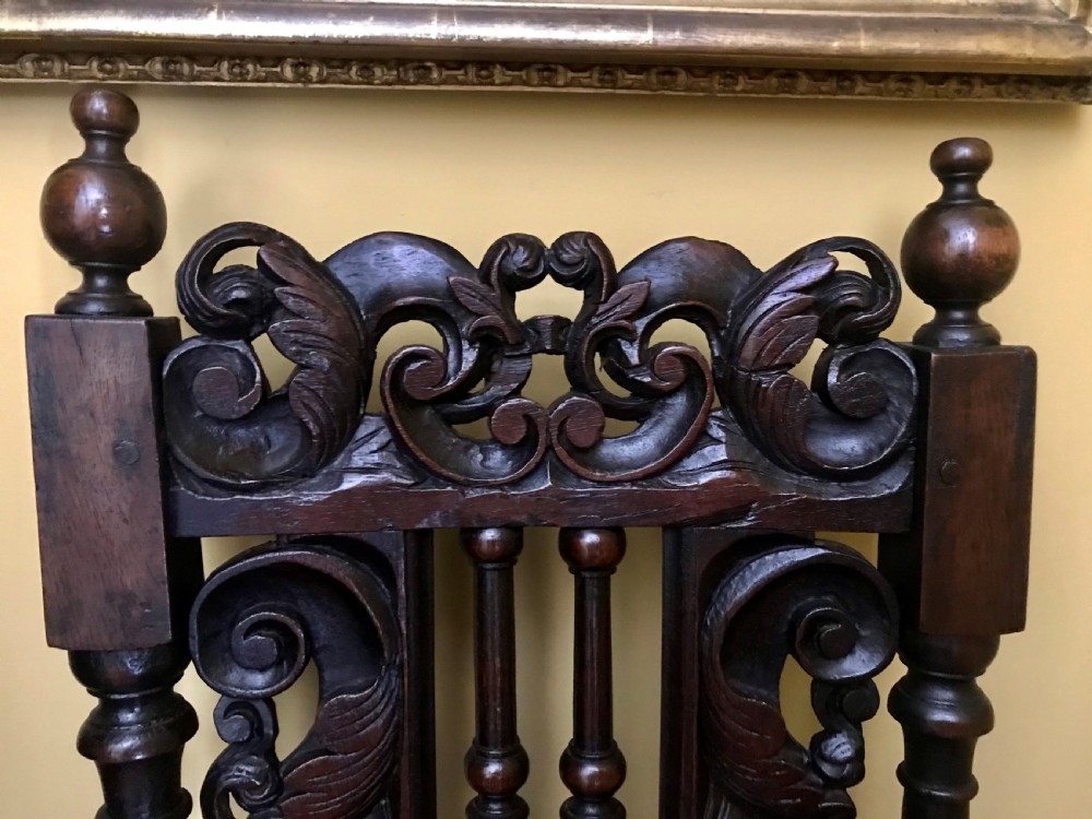 A Fine Pair of Carved Oak Highback chairs c.1690. View IV