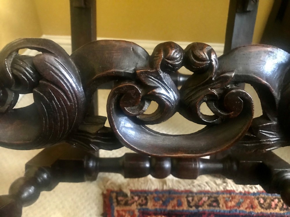 A Fine Pair of Carved Oak Highback chairs c.1690. View V
