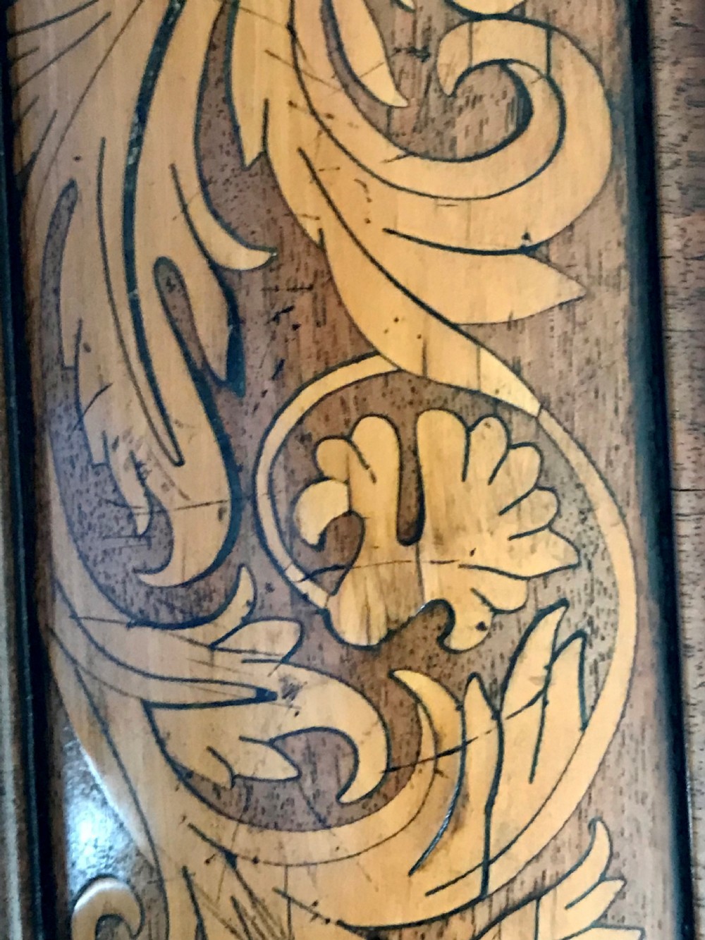 A rectangular William and Mary period wall mirror featuring a broad wooden cushion frame decorated with intricate floral marquetry inlays. View III