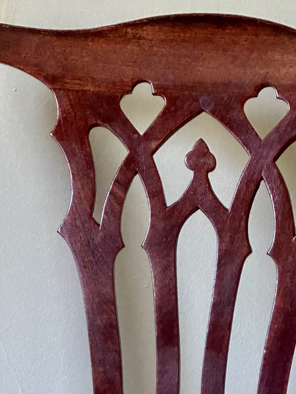 A Georgian mahogany side chair featuring cabriole front legs, a Gothic pierced splat back, and a red fabric drop-in seat. View III