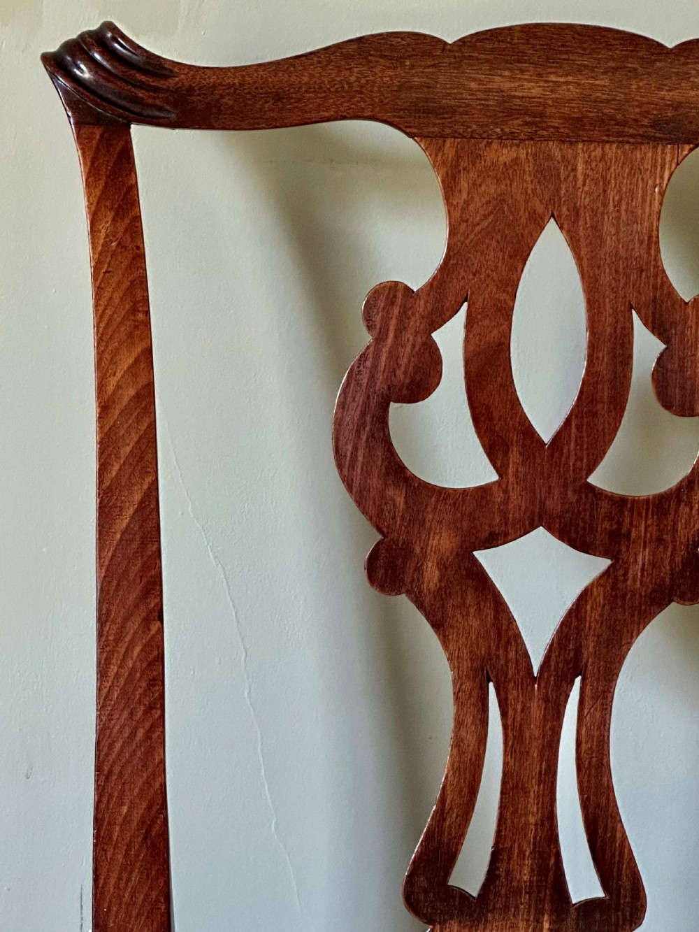 A George II walnut side chair featuring a carved pierced back splat, an upholstered drop-in seat, and front cabriole legs with pad feet. View II