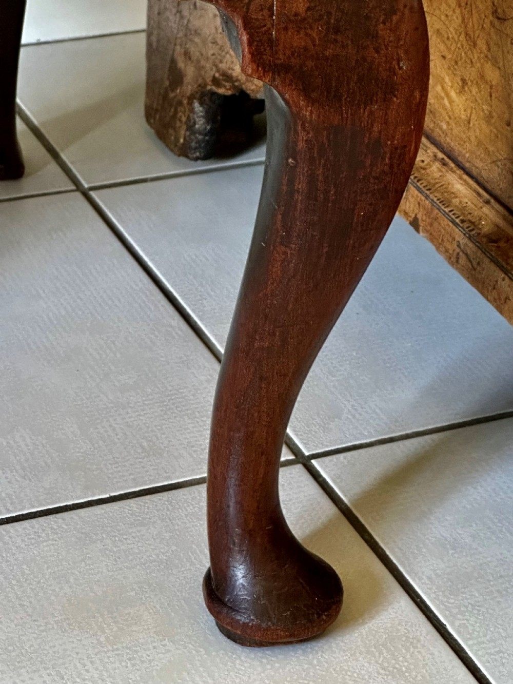 A George II walnut side chair featuring a carved pierced back splat, an upholstered drop-in seat, and front cabriole legs with pad feet. View III