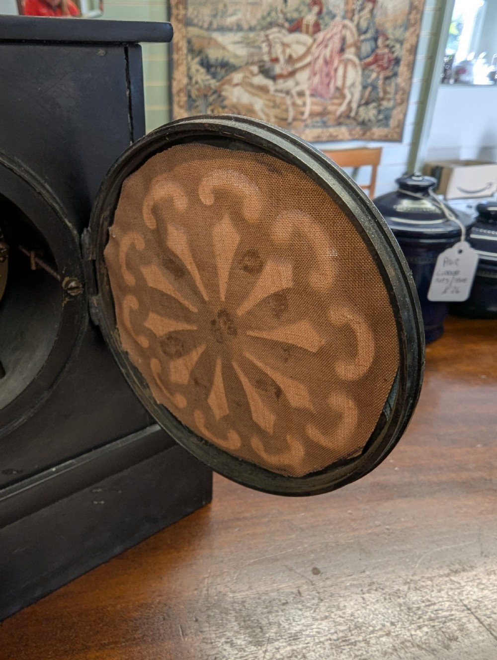 A Victorian black marble and slate mantel clock featuring incised gilded floral patterns, a white enamel dial with Roman numerals, and a brass presentation plaque. View IX