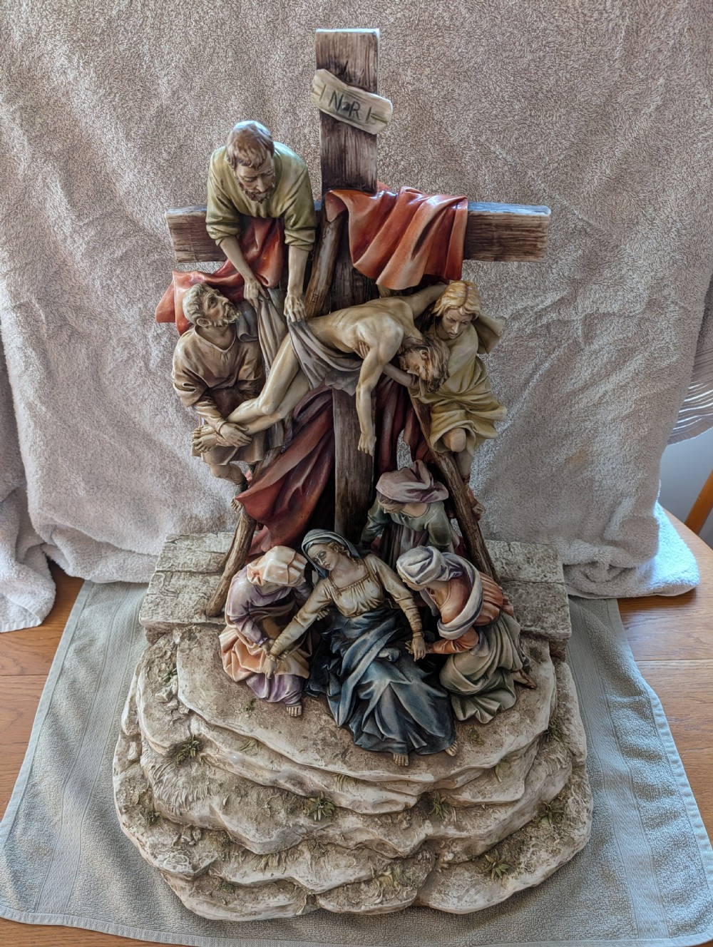 A detailed polychrome porcelain sculpture by Antonio Borsato depicting the Descent from the Cross with multiple hand-painted figures. View II