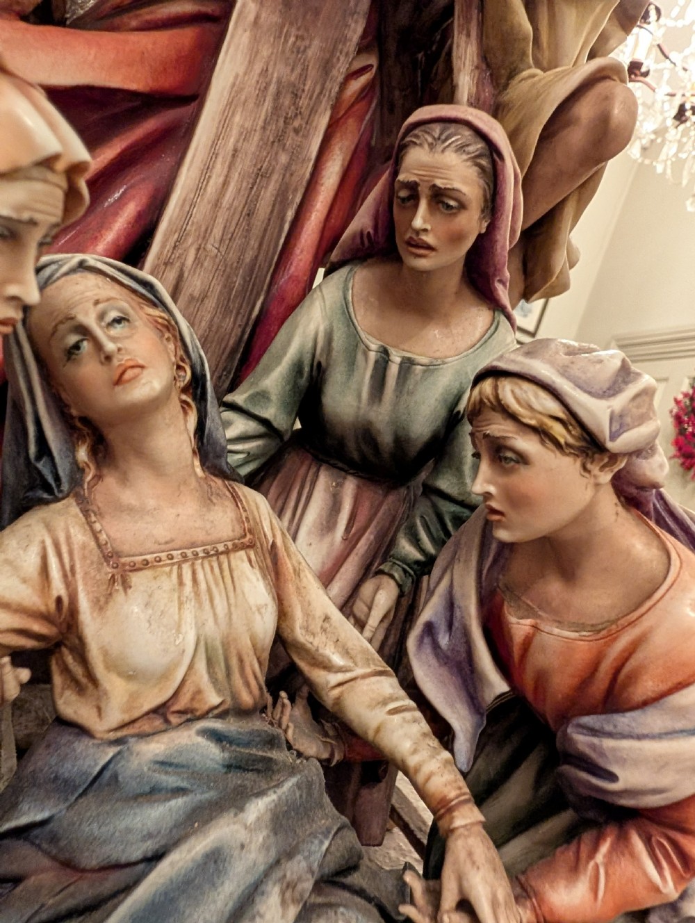 A detailed polychrome porcelain sculpture by Antonio Borsato depicting the Descent from the Cross with multiple hand-painted figures. View IV