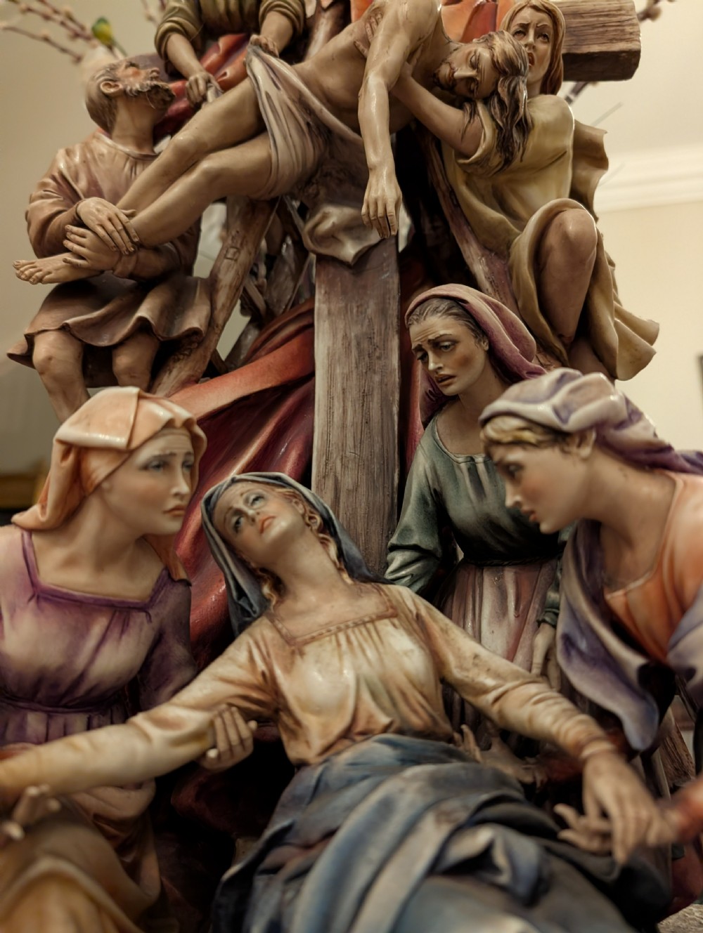 A detailed polychrome porcelain sculpture by Antonio Borsato depicting the Descent from the Cross with multiple hand-painted figures. View VI