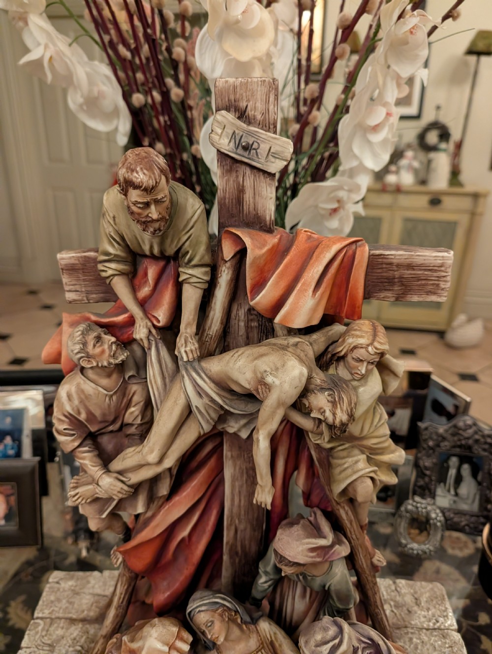 A detailed polychrome porcelain sculpture by Antonio Borsato depicting the Descent from the Cross with multiple hand-painted figures. View VIII