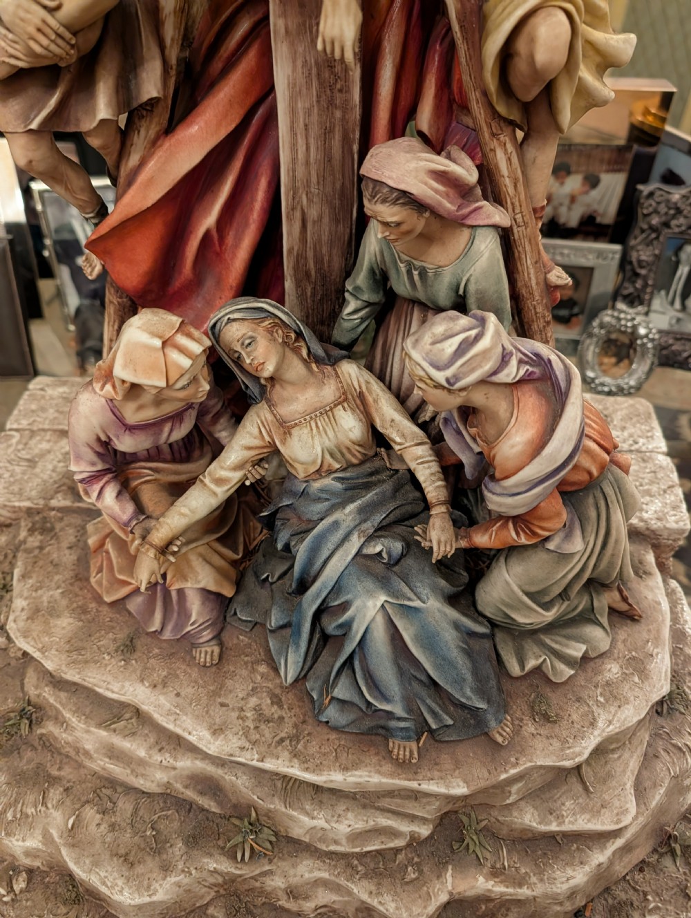 A detailed polychrome porcelain sculpture by Antonio Borsato depicting the Descent from the Cross with multiple hand-painted figures. View IX