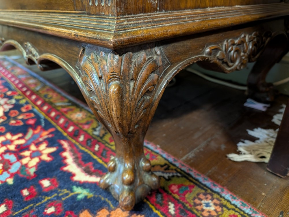 A late Victorian carved oak buffet featuring two top drawers with brass drop handles, an open tier, and a lower double-door cabinet decorated with detailed carved foliage. View II