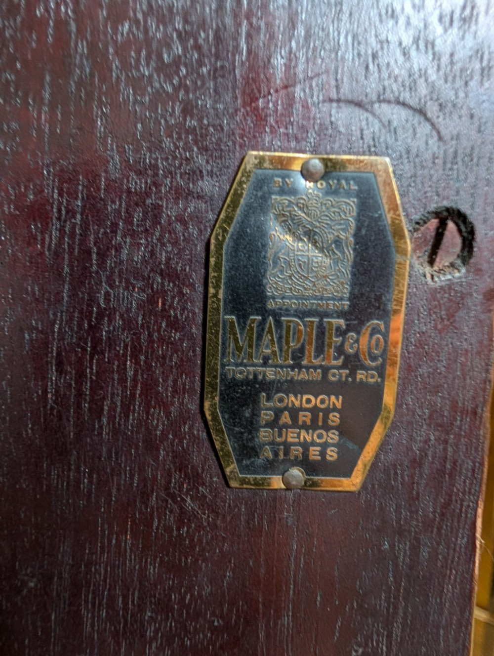 An Edwardian mahogany corner display cabinet featuring a swan-neck pediment, astragal glazed top doors, and lower inlaid timber panelled doors. View II