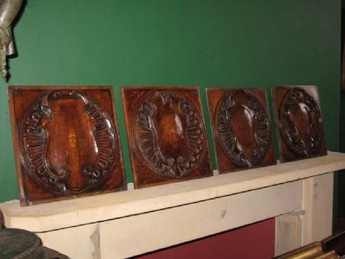Four Carved Walnut Heraldic Panels