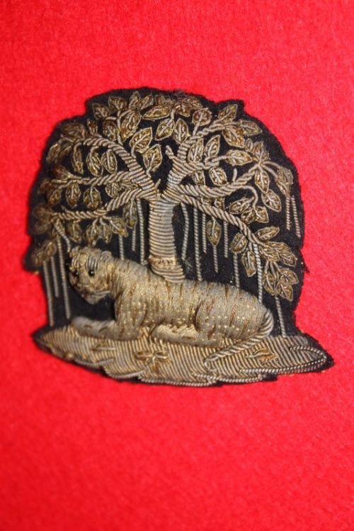fig 1. metal needlework badge of a tiger