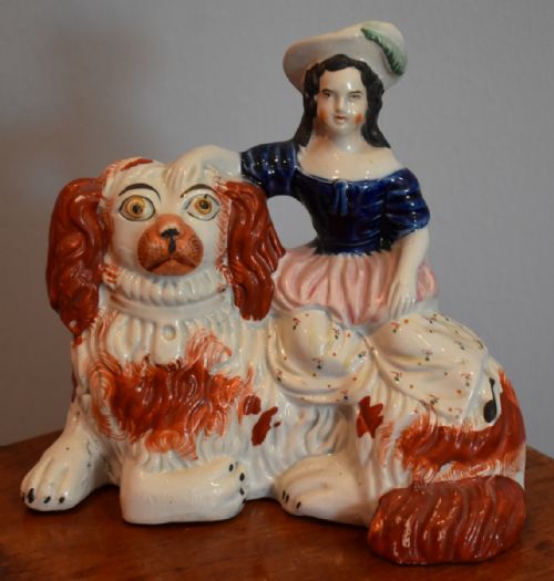 rare staffordshire figure of a girl on a spaniel dog - CATEGORY: ANTIQUE CERAMICS - DATED 1860
