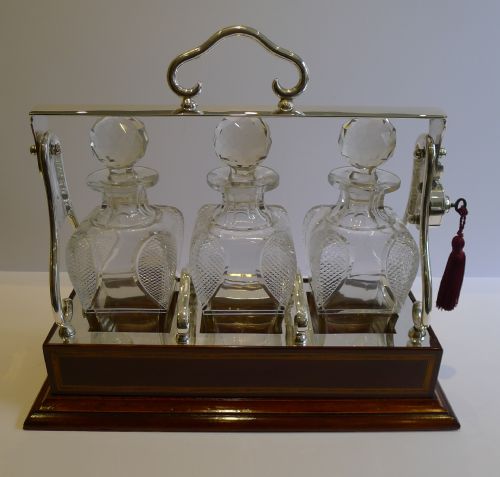 Outstanding Inlaid Mahogany and Silver Plate Tantalus / Decanter Caddy - Shaped & Cut Bottles