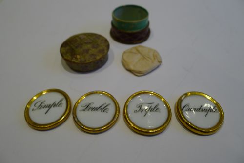 fig 1. Boxed Set Four Painted Porcelain Whist Markers c.1850