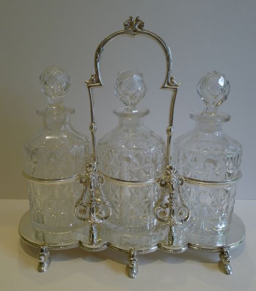 Antique English Figural Tantalus in Silver Plate with Cut Crystal Decanters