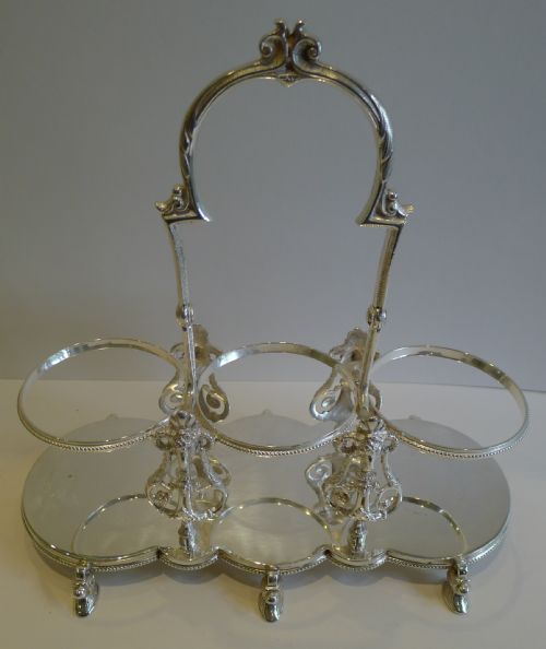 fig 1. Antique English Figural Tantalus in Silver Plate With Cut Crystal Decanters