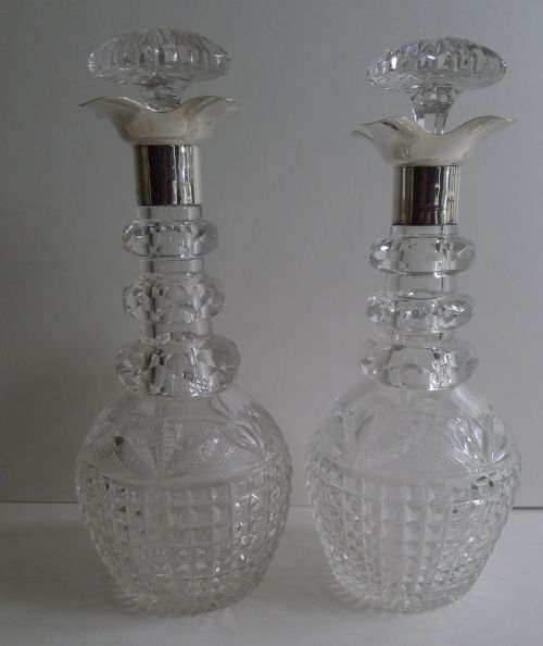 Pair Finest Quality Cut Crystal and English Sterling Silver Decanters