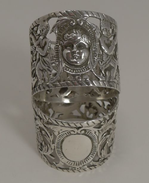 Magnificent Figural Pair Victorian Sterling Silver Napkin Rings by William Comyns