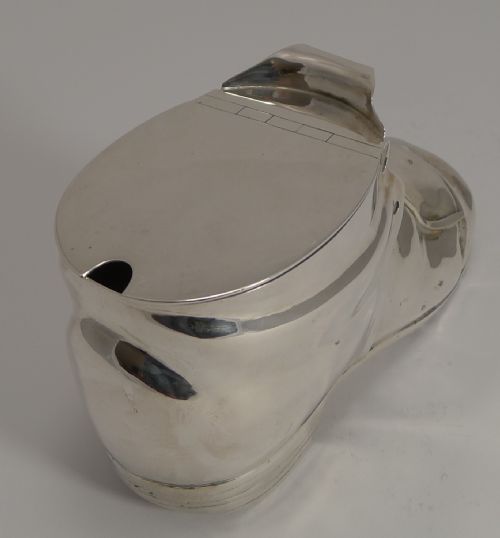 fig 1. A Victorian silver-plated novelty spoon warmer designed in the form of a laced shoe with a hinged opening lid.