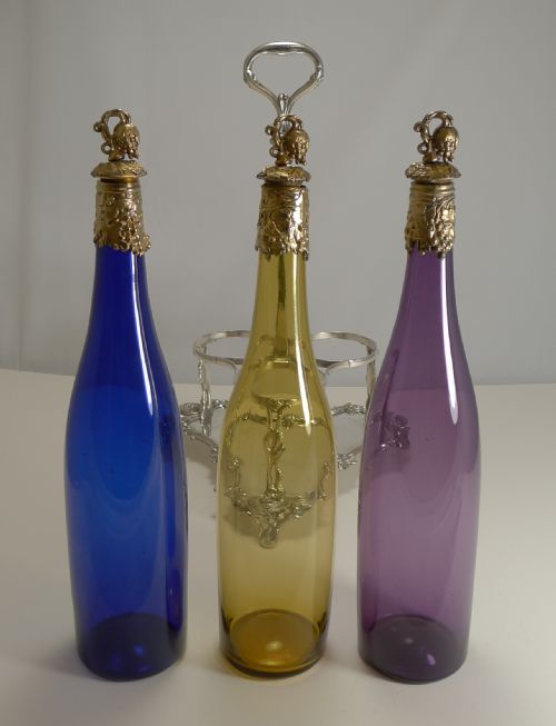 fig 1. Three Victorian Coloured Glass Decanters In Stand c.1890