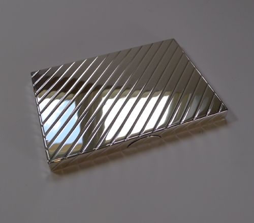 fig 1. A rectangular Art Deco sterling silver box featuring diagonal engine-turned reeded pattern across its polished surface.