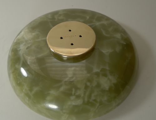 fig 2. A 19th-century French gilded bronze centrepiece featuring sculpted cherubs around a central trunk stem supporting a shallow green onyx bowl.