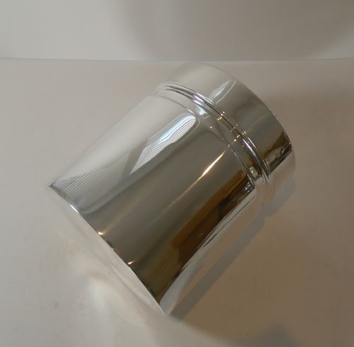 fig 1. A polished silver-plated cylindrical wine cooler featuring a thick double-walled rim and smooth metallic surface.