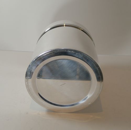 fig 3. A polished silver-plated cylindrical wine cooler featuring a thick double-walled rim and smooth metallic surface.