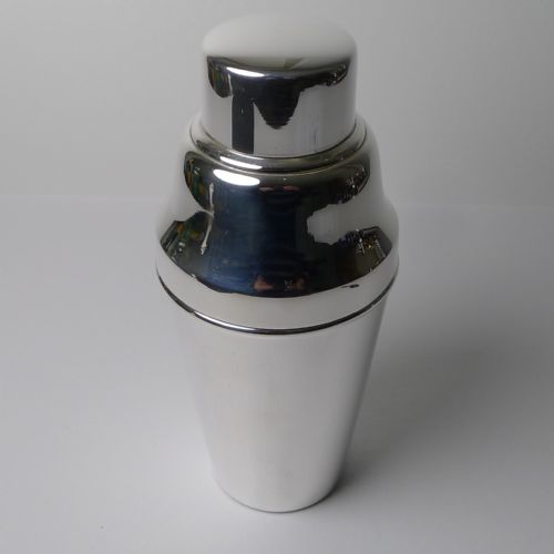 fig 1. A polished silver-plated Art Deco three-piece cocktail shaker featuring a tapered lower body and a stepped cap.