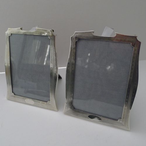 fig 1. A pair of matching Art Deco silver picture frames with engine-turned geometric engraving and easel backs.