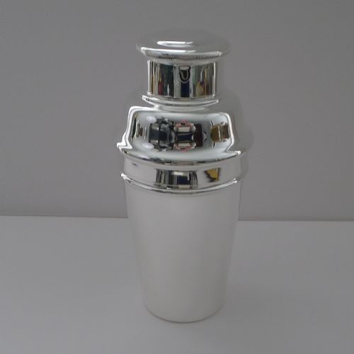 fig 1. An Art Deco silver plated three-piece cocktail shaker with a polished finish and stepped cap.