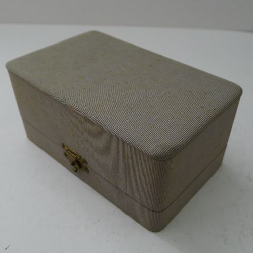 fig 1. A pair of textured French sterling silver and silver-gilt napkin rings presented in an original fitted grey fabric Hermes presentation box.
