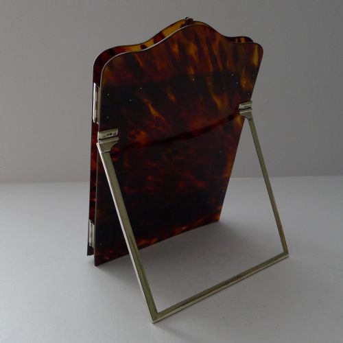 fig 3. A late 19th-century Victorian tortoiseshell photograph frame featuring arched folding doors, pierced sterling silver mounts, and a silver easel back.