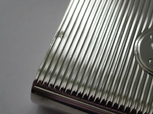 fig 2. A late Victorian sterling silver prayer book holder featuring vertical reeded decoration, an engraved monogram roundel, and a suspension chain with a finger ring.