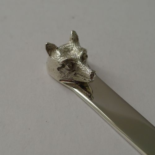 fig 2. A polished sterling silver letter opener featuring a cast fox head finial atop a smooth tapered blade.