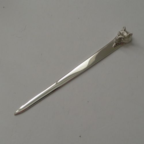 fig 1. A polished sterling silver letter opener featuring a cast fox head finial atop a smooth tapered blade.
