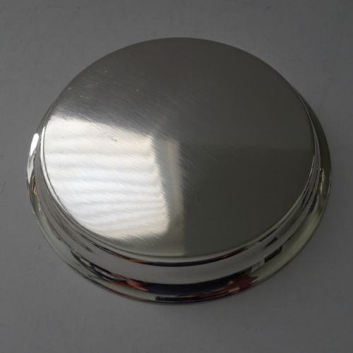 fig 3. A circular polished silver dish featuring a sculpted equestrian horse head handle at the centre.