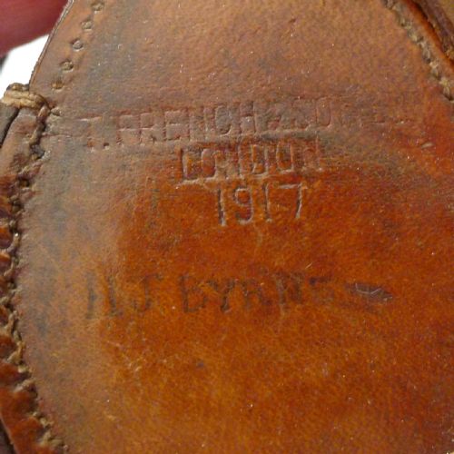 fig 1. An antique brass Verners pattern military compass housed inside a fitted brown leather carrying case with a long leather strap.