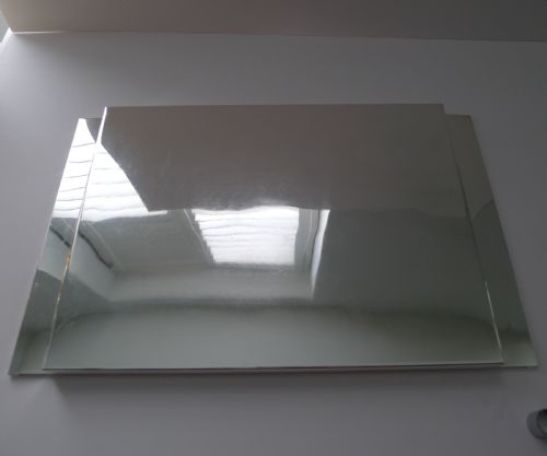 fig 1. A rectangular polished silver-plated tray featuring cast bamboo-style handles along two opposite ends.