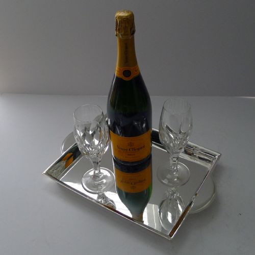 fig 1. A polished rectangular silver-plated cocktail tray featuring a stepped moulded rim and integrated curved handles.